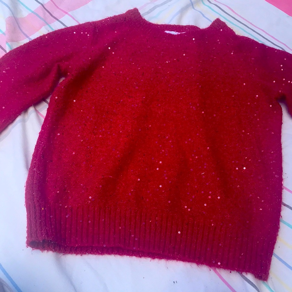 Selling a cute red shirt that’s comfy for eight year old no rips or tears